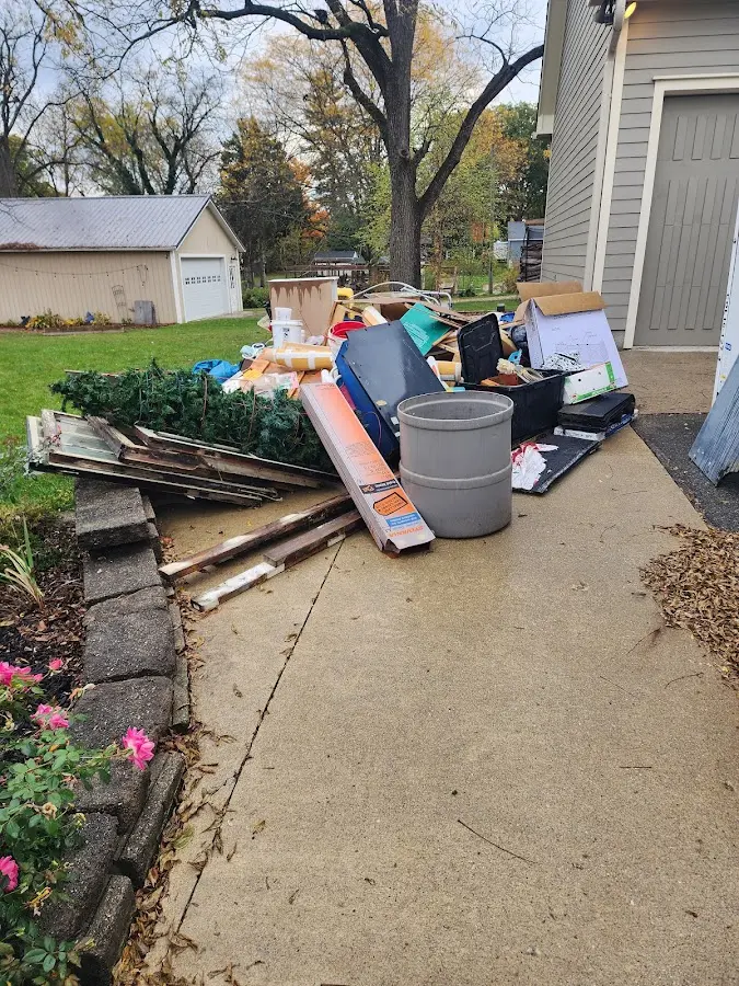 Dumpster being loaded with debris for 30 Yard Dumpster Rental in Pamelia
